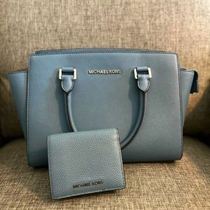 Authentic Michael Kors Satchel with matching wallet.